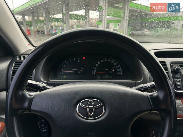 Серый Тойота Камри, объемом двигателя 2.36 л и пробегом 617 тыс. км за 5700 $, фото 12 на Automoto.ua