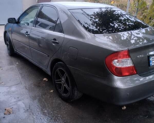 Серый Тойота Камри, объемом двигателя 2.4 л и пробегом 250 тыс. км за 4500 $, фото 8 на Automoto.ua