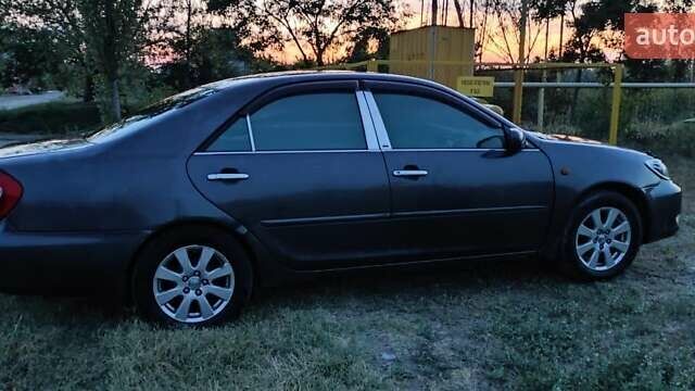 Серый Тойота Камри, объемом двигателя 2.36 л и пробегом 350 тыс. км за 4500 $, фото 1 на Automoto.ua