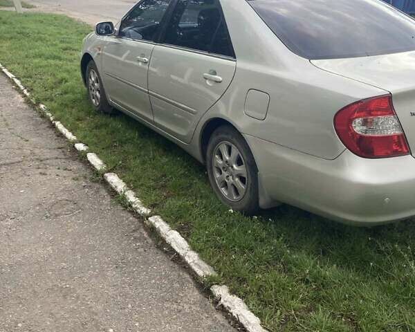 Сірий Тойота Камрі, об'ємом двигуна 2.4 л та пробігом 300 тис. км за 5400 $, фото 1 на Automoto.ua