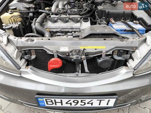 Сірий Тойота Камрі, об'ємом двигуна 3 л та пробігом 284 тис. км за 5700 $, фото 25 на Automoto.ua
