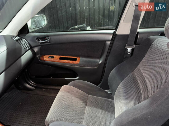 Серый Тойота Камри, объемом двигателя 2.4 л и пробегом 101 тыс. км за 7500 $, фото 12 на Automoto.ua