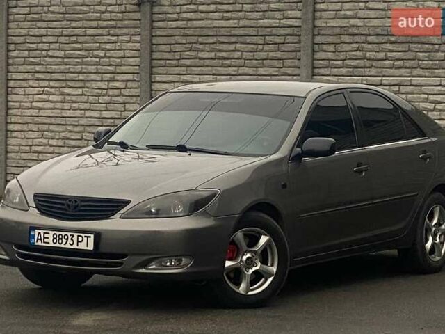 Серый Тойота Камри, объемом двигателя 2.4 л и пробегом 270 тыс. км за 5600 $, фото 1 на Automoto.ua