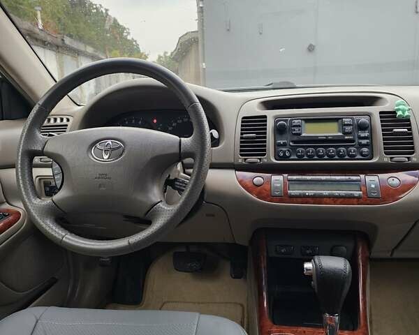 Серый Тойота Камри, объемом двигателя 3 л и пробегом 330 тыс. км за 3100 $, фото 21 на Automoto.ua