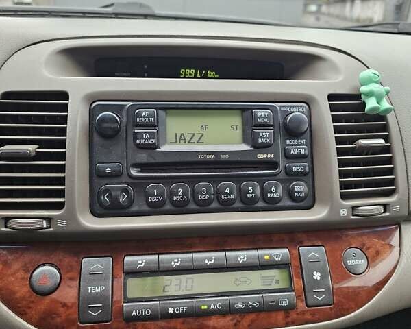 Серый Тойота Камри, объемом двигателя 3 л и пробегом 330 тыс. км за 3100 $, фото 19 на Automoto.ua