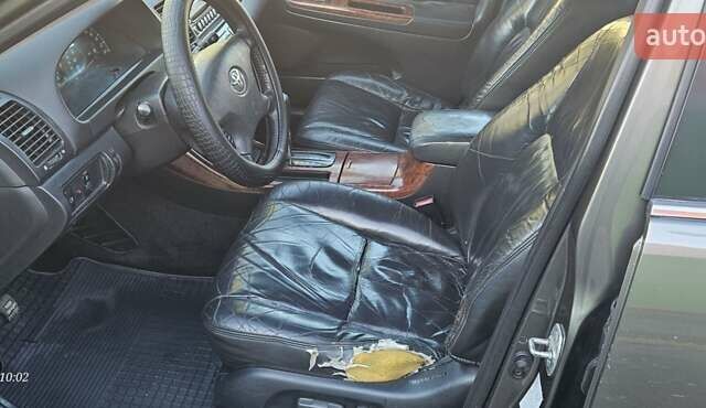 Серый Тойота Камри, объемом двигателя 3 л и пробегом 210 тыс. км за 4800 $, фото 1 на Automoto.ua