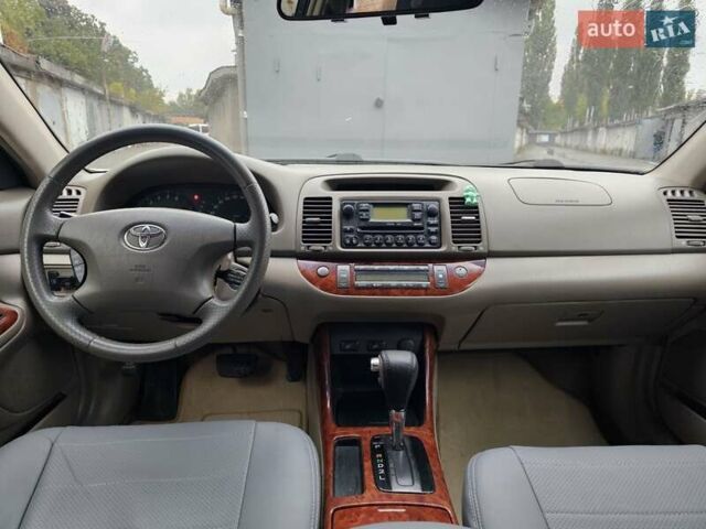 Серый Тойота Камри, объемом двигателя 3 л и пробегом 330 тыс. км за 3100 $, фото 14 на Automoto.ua