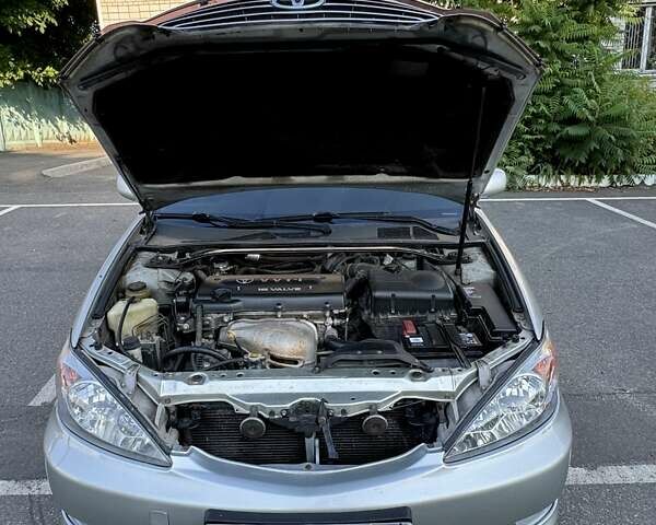 Серый Тойота Камри, объемом двигателя 2.36 л и пробегом 350 тыс. км за 6500 $, фото 10 на Automoto.ua