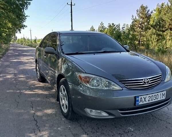 Серый Тойота Камри, объемом двигателя 2.37 л и пробегом 320 тыс. км за 5700 $, фото 20 на Automoto.ua