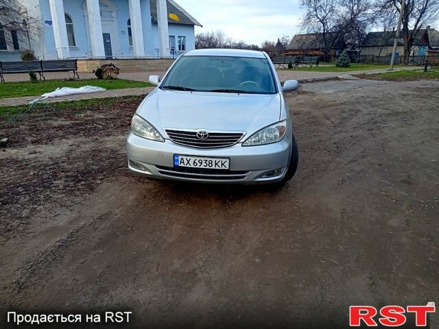 Сірий Тойота Камрі, об'ємом двигуна 2.4 л та пробігом 266 тис. км за 6750 $, фото 1 на Automoto.ua