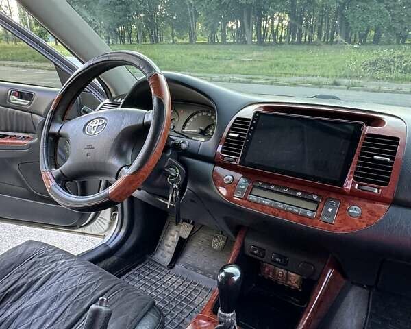 Серый Тойота Камри, объемом двигателя 2.36 л и пробегом 350 тыс. км за 6500 $, фото 8 на Automoto.ua