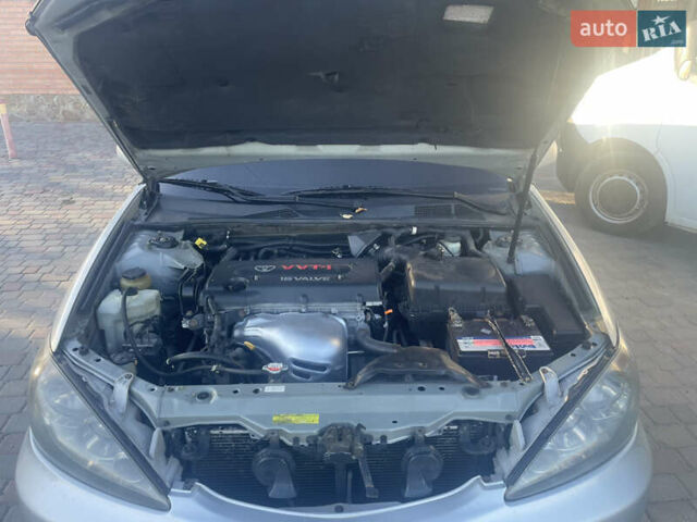 Серый Тойота Камри, объемом двигателя 2.4 л и пробегом 469 тыс. км за 6200 $, фото 32 на Automoto.ua