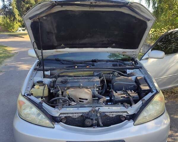 Серый Тойота Камри, объемом двигателя 2.36 л и пробегом 308 тыс. км за 4500 $, фото 17 на Automoto.ua