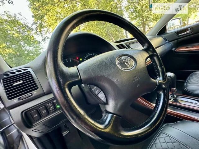 Серый Тойота Камри, объемом двигателя 2.36 л и пробегом 213 тыс. км за 6300 $, фото 34 на Automoto.ua