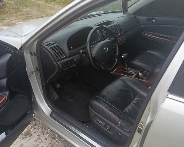 Серый Тойота Камри, объемом двигателя 2.36 л и пробегом 260 тыс. км за 6700 $, фото 1 на Automoto.ua