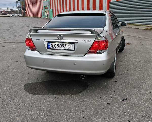 Сірий Тойота Камрі, об'ємом двигуна 3 л та пробігом 317 тис. км за 7700 $, фото 3 на Automoto.ua