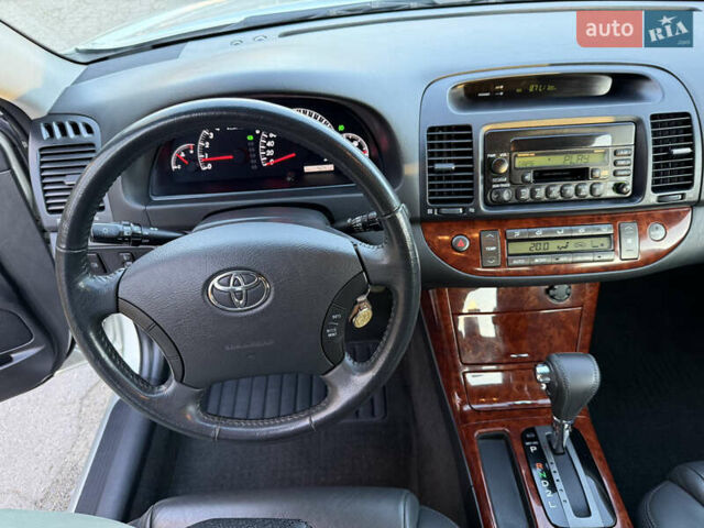 Серый Тойота Камри, объемом двигателя 2.4 л и пробегом 42 тыс. км за 10900 $, фото 86 на Automoto.ua