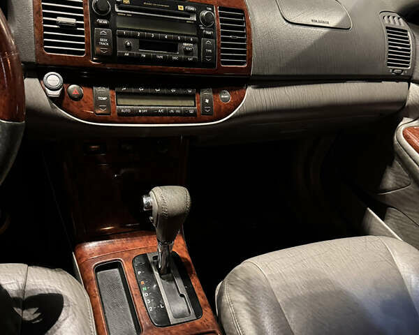 Серый Тойота Камри, объемом двигателя 3 л и пробегом 240 тыс. км за 7200 $, фото 19 на Automoto.ua