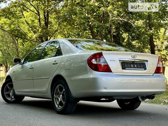 Серый Тойота Камри, объемом двигателя 2.36 л и пробегом 213 тыс. км за 6300 $, фото 28 на Automoto.ua