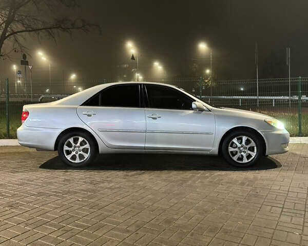 Серый Тойота Камри, объемом двигателя 3 л и пробегом 240 тыс. км за 7200 $, фото 4 на Automoto.ua