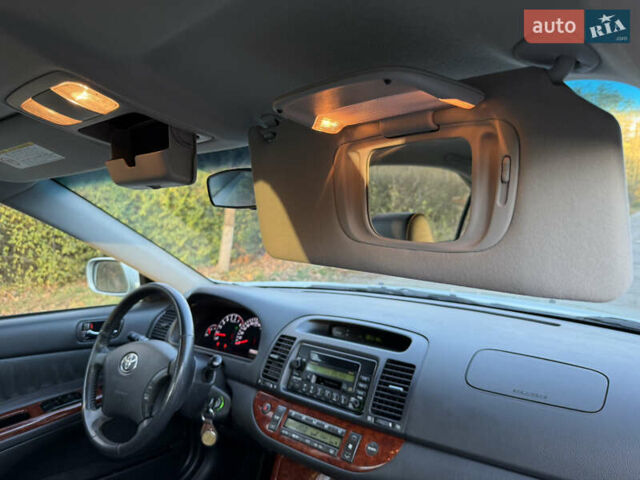 Серый Тойота Камри, объемом двигателя 2.4 л и пробегом 42 тыс. км за 10900 $, фото 114 на Automoto.ua