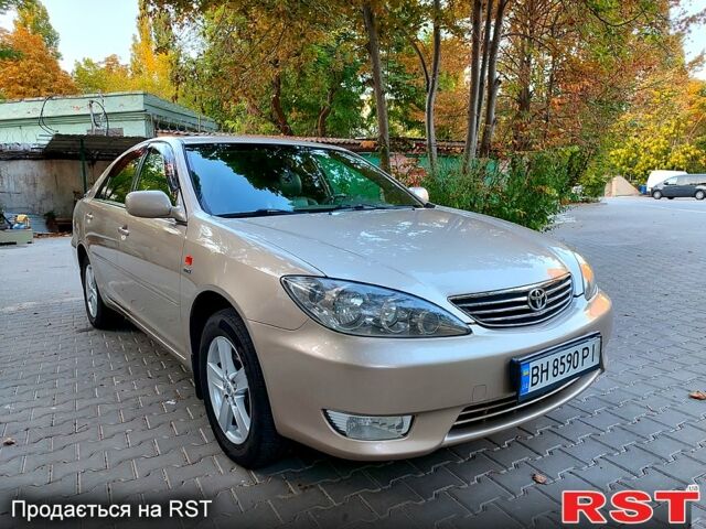 Серый Тойота Камри, объемом двигателя 2.4 л и пробегом 185 тыс. км за 7999 $, фото 2 на Automoto.ua