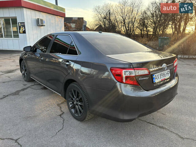 Сірий Тойота Камрі, об'ємом двигуна 2.49 л та пробігом 190 тис. км за 11800 $, фото 4 на Automoto.ua
