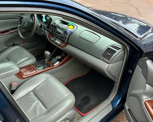 Синий Тойота Камри, объемом двигателя 2.4 л и пробегом 233 тыс. км за 5200 $, фото 8 на Automoto.ua