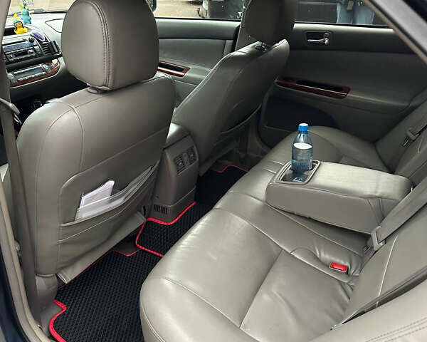 Синий Тойота Камри, объемом двигателя 2.4 л и пробегом 233 тыс. км за 5200 $, фото 6 на Automoto.ua