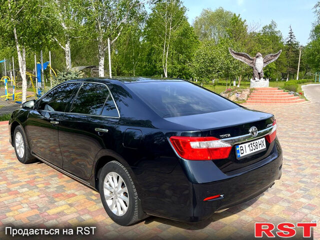 Синий Тойота Камри, объемом двигателя 2.5 л и пробегом 209 тыс. км за 13450 $, фото 2 на Automoto.ua