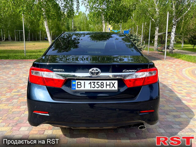 Синий Тойота Камри, объемом двигателя 2.5 л и пробегом 209 тыс. км за 13450 $, фото 4 на Automoto.ua