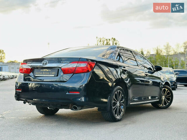 Синій Тойота Камрі, об'ємом двигуна 2.49 л та пробігом 231 тис. км за 12700 $, фото 1 на Automoto.ua