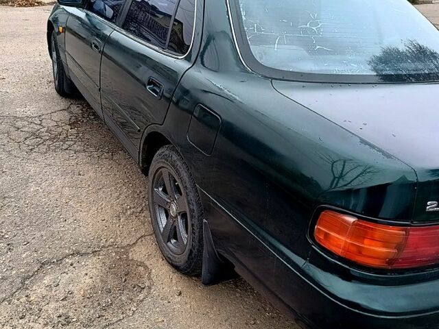 Зелений Тойота Камрі, об'ємом двигуна 2.2 л та пробігом 350 тис. км за 2150 $, фото 5 на Automoto.ua