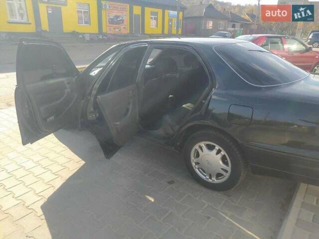 Зеленый Тойота Камри, объемом двигателя 3 л и пробегом 347 тыс. км за 2800 $, фото 6 на Automoto.ua