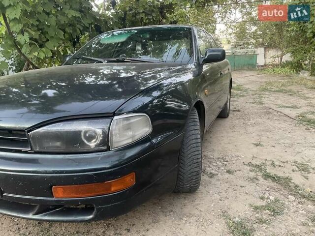 Зелений Тойота Камрі, об'ємом двигуна 3 л та пробігом 400 тис. км за 2800 $, фото 7 на Automoto.ua