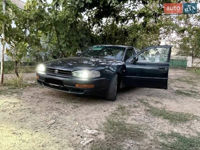 Зелений Тойота Камрі, об'ємом двигуна 3 л та пробігом 400 тис. км за 2800 $, фото 1 на Automoto.ua