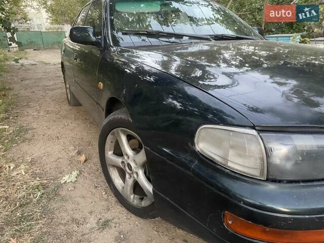 Зелений Тойота Камрі, об'ємом двигуна 3 л та пробігом 400 тис. км за 2800 $, фото 6 на Automoto.ua