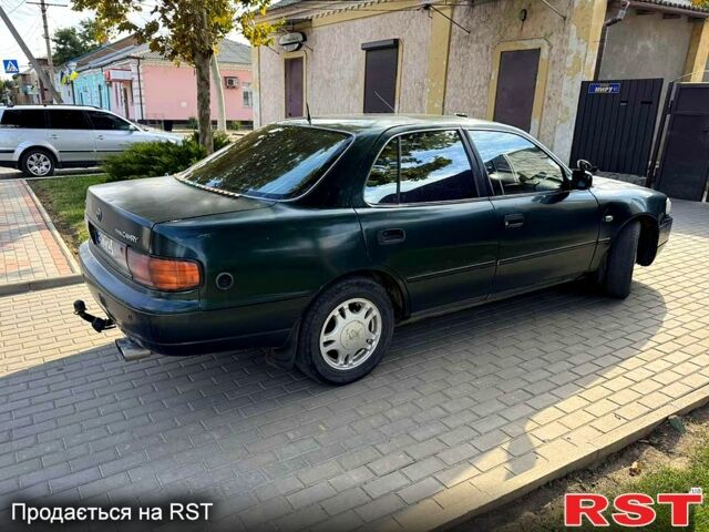 Зеленый Тойота Камри, объемом двигателя 2.2 л и пробегом 235 тыс. км за 2100 $, фото 1 на Automoto.ua