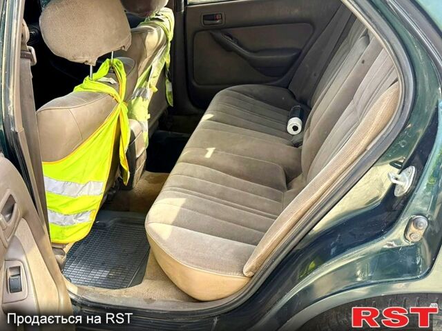 Зеленый Тойота Камри, объемом двигателя 2.2 л и пробегом 235 тыс. км за 2100 $, фото 5 на Automoto.ua