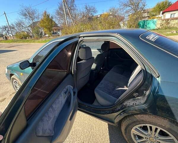 Зеленый Тойота Камри, объемом двигателя 2.16 л и пробегом 407 тыс. км за 3700 $, фото 11 на Automoto.ua