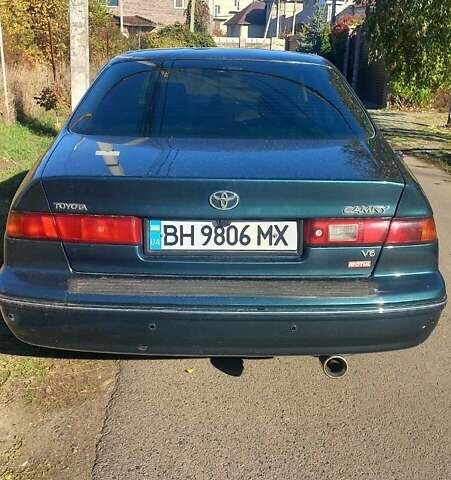 Зелений Тойота Камрі, об'ємом двигуна 3 л та пробігом 394 тис. км за 3900 $, фото 6 на Automoto.ua