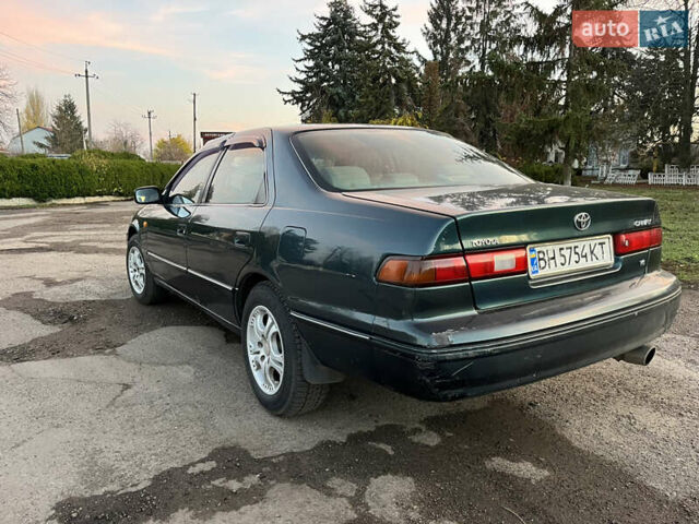 Зеленый Тойота Камри, объемом двигателя 3 л и пробегом 355 тыс. км за 3400 $, фото 5 на Automoto.ua