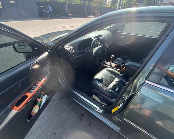 Зелений Тойота Камрі, об'ємом двигуна 2.4 л та пробігом 256 тис. км за 6000 $, фото 8 на Automoto.ua