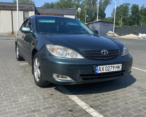 Зелений Тойота Камрі, об'ємом двигуна 2.4 л та пробігом 256 тис. км за 6000 $, фото 1 на Automoto.ua