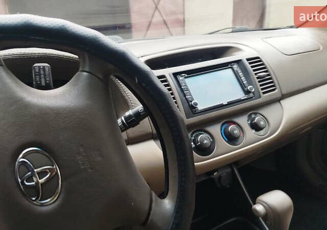 Зеленый Тойота Камри, объемом двигателя 2.4 л и пробегом 430 тыс. км за 4999 $, фото 8 на Automoto.ua