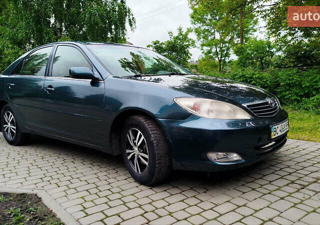 Зеленый Тойота Камри, объемом двигателя 2.4 л и пробегом 430 тыс. км за 4999 $, фото 2 на Automoto.ua