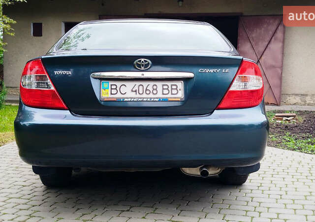 Зеленый Тойота Камри, объемом двигателя 2.4 л и пробегом 430 тыс. км за 4999 $, фото 1 на Automoto.ua