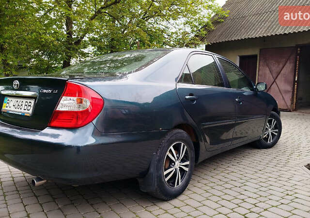 Зеленый Тойота Камри, объемом двигателя 2.4 л и пробегом 430 тыс. км за 4999 $, фото 6 на Automoto.ua