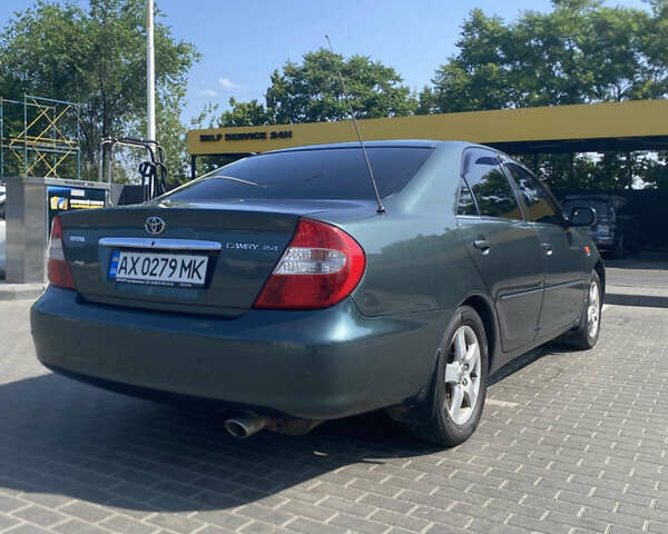 Зелений Тойота Камрі, об'ємом двигуна 2.4 л та пробігом 256 тис. км за 6000 $, фото 4 на Automoto.ua