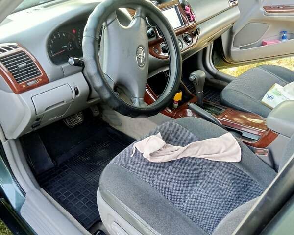 Зелений Тойота Камрі, об'ємом двигуна 2.36 л та пробігом 270 тис. км за 5300 $, фото 6 на Automoto.ua